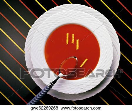 High angle view of a spoon in a bowl of tomato soup View Large Photo Image Stock Photo - High angle view of a spoon in a bowl of tomato soup. Fotosearch