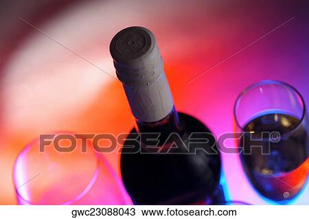 High angle view of a wine bottle with two wineglasses View Large Photo Image Stock Image - High angle view of a wine bottle with two wineglasses. Fotosearch