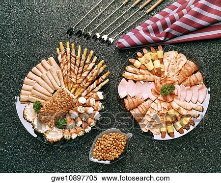 High angle view of assorted foods on plates View Large Photo Image Stock Photography - High angle view of assorted foods on plates. Fotosearch
