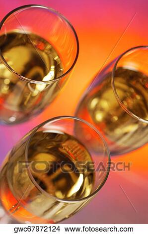 High angle view of champagne in three champagne flutes View Large Photo Image Picture - High angle view of champagne in three champagne flutes. Fotosearch