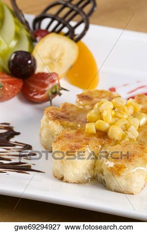 High angle view of corn cakes in a plate View Large Photo Image Stock Photo - High angle view of corn cakes in a plate. Fotosearch