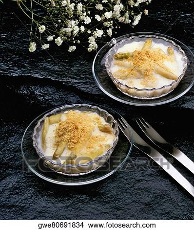 High angle view of esparragos gratin on bowls View Large Photo Image Picture - High angle view of esparragos gratin on bowls. Fotosearch