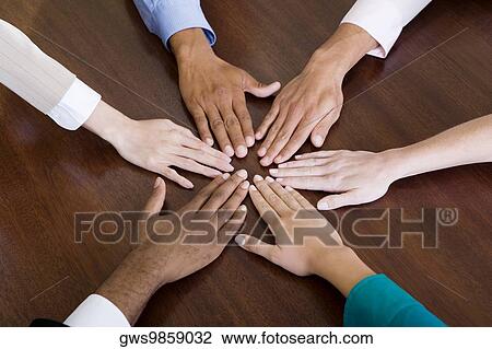 High angle view of human hands on the table View Large Photo Image Stock Image - High angle view of human hands on the table. Fotosearch