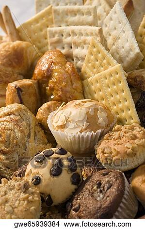 High angle view of muffins and crackers in a wicker basket View Large Photo Image Picture - High angle view of muffins and crackers in a wicker basket. Fotosearch