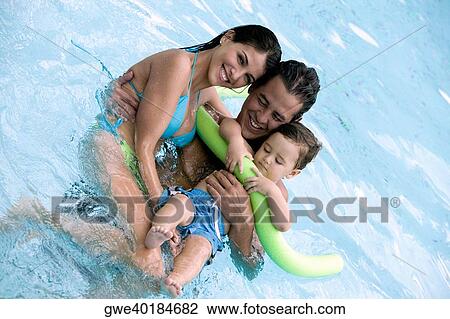 High angle view of parents with their son in a swimming pool View Large Photo Image Stock Image - High angle view of parents with their son in a swimming pool. Fotosearch