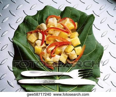 Stock Image - High angle view of pollo hawaiano on a leaf. Fotosearch
