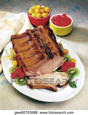 Stock Photo - High angle view of roast pork ribs. Fotosearch