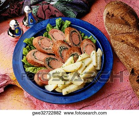 Stock Image - High angle view of rollos jamon on a plate. Fotosearch