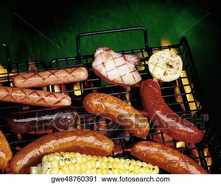 High angle view of sausages and corn on a barbecue grill View Large Photo Image Stock Image - High angle view of sausages and corn on a barbecue grill. Fotosearch