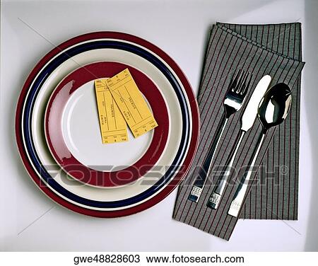 High angle view of two admission tickets on a plate View Large Photo Image Stock Image - High angle view of two admission tickets on a plate. Fotosearch