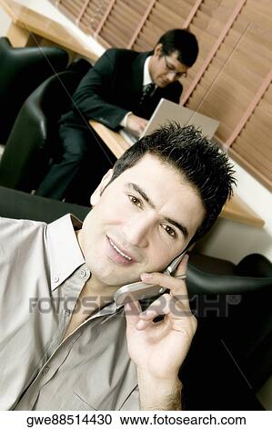 High angle view of two businessmen working in an office View Large Photo Image Stock Image - High angle view of two businessmen working in an office. Fotosearch