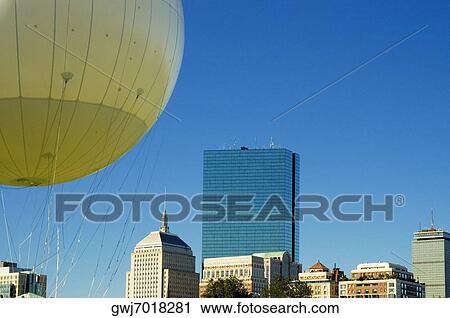 Stock Image - Hot air balloon in front of buildings, Boston, Massachusetts, USA. Fotosearch