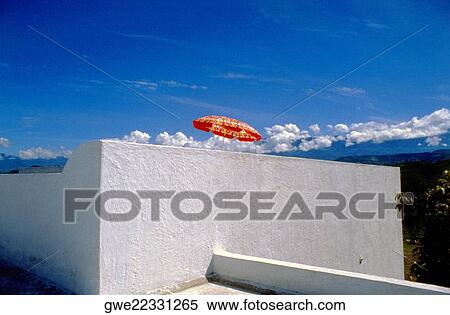 Low angle view of a patio umbrella on a terrace View Large Photo Image Stock Photography - Low angle view of a patio umbrella on a terrace. Fotosearch