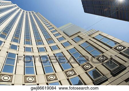 Low angle view of a skyscraper in a city, New York City, New York State, USA View Large Photo Image Picture - Low angle view of a skyscraper in a city, New York City, New York State, USA. Fotosearch