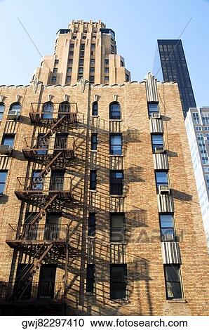 Low angle view of a skyscraper in a city, New York City, New York State, USA View Large Photo Image Stock Image - Low angle view of a skyscraper in a city, New York City, New York State, USA. Fotosearch