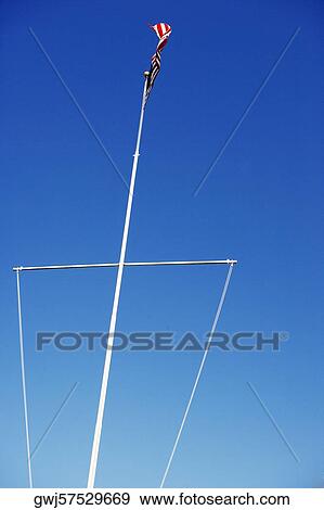 Low angle view of boat mast with the USA Flag waving, Washington DC, USA View Large Photo Image Stock Photo - Low angle view of boat mast with the USA Flag waving, Washington DC, USA. Fotosearch