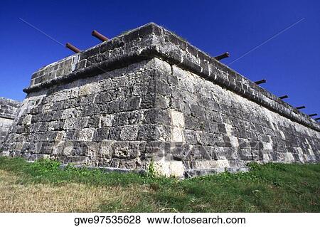 Stock Photo - Low angle view of cannons on a stone wall. Fotosearch
