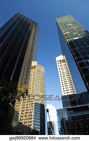 Low angle view of skyscrapers in a city, New York City, New York State, USA View Large Photo Image Picture - Low angle view of skyscrapers in a city, New York City, New York State, USA. Fotosearch