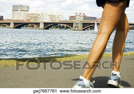 Low section view of a person jogging View Large Photo Image Stock Image - Low section view of a person jogging. Fotosearch