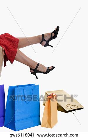 Low section view of a woman wearing stilettos View Large Photo Image Stock Image - Low section view of a woman wearing stilettos. Fotosearch