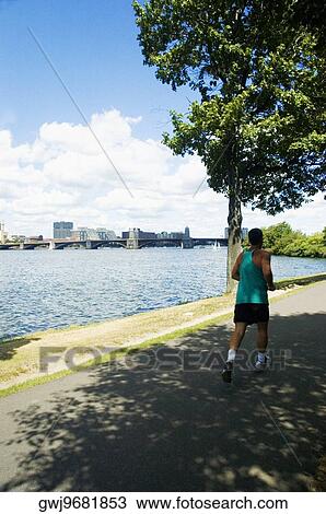 Man jogging on the bank of a river, Charles River, Longfellow Bridge, Boston, Massachusetts, USA View Large Photo Image Stock Image - Man jogging on the bank of a river, Charles River, Longfellow Bridge, Boston, Massachusetts, USA. Fotosearch