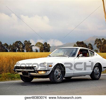 Picture - Man sitting in a car. Fotosearch