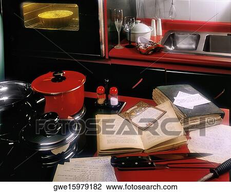 Stock Image - Microwave and utensils in the kitchen. Fotosearch
