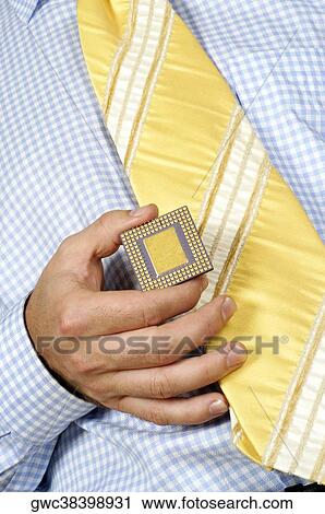 Mid section view of a businessman holding a computer chip View Large Photo Image Stock Image - Mid section view of a businessman holding a computer chip. Fotosearch