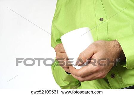 Mid section view of a man holding a mug View Large Photo Image Stock Image - Mid section view of a man holding a mug. Fotosearch