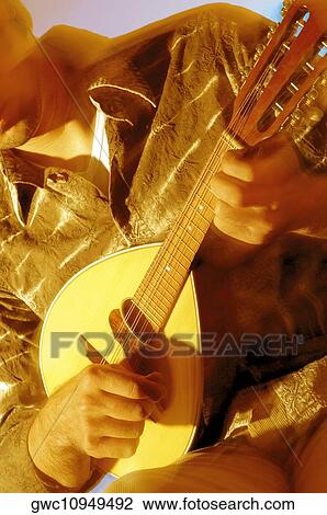 Mid section view of a musician playing the banjo View Large Photo Image Stock Image - Mid section view of a musician playing the banjo. Fotosearch
