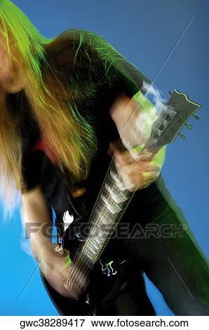 Mid section view of a musician playing the electric guitar View Large Photo Image Stock Photo - Mid section view of a musician playing the electric guitar. Fotosearch