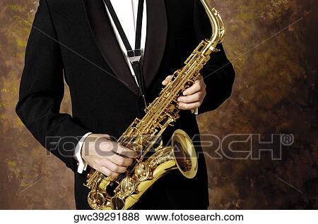 Mid section view of a musician playing the saxophone View Large Photo Image Stock Photo - Mid section view of a musician playing the saxophone. Fotosearch