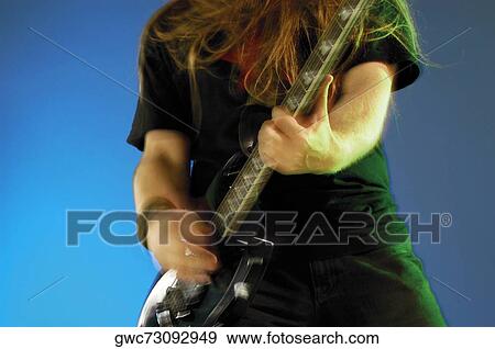 Mid section view of a musician playing the electric guitar View Large Photo Image Stock Photo - Mid section view of a musician playing the electric guitar. Fotosearch