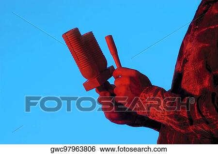 Mid section view of a musician playing the maracas View Large Photo Image Stock Photograph - Mid section view of a musician playing the maracas. Fotosearch