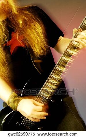 Mid section view of a musician playing the electric guitar View Large Photo Image Stock Photography - Mid section view of a musician playing the electric guitar. Fotosearch