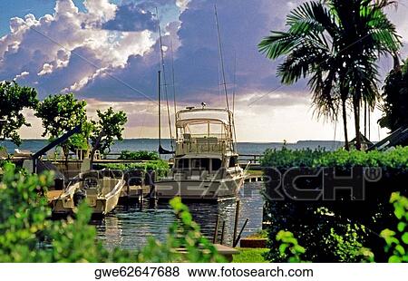 Stock Photo - Moored boats at a pier. Fotosearch