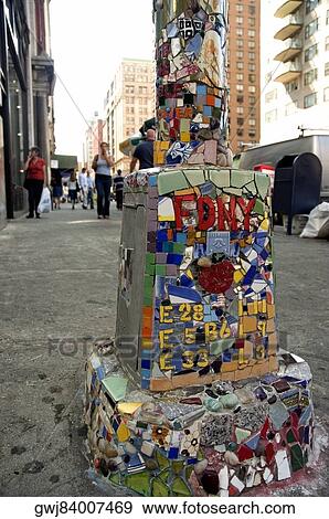 Stock Photo - Mosaic work on a lamppost, New York City, New York State, USA. Fotosearch
