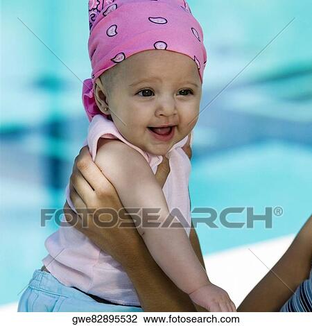 Mother holding her daughter View Large Photo Image Stock Image - Mother holding her daughter. Fotosearch