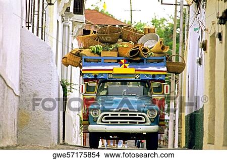 Picture - Over loaded truck on the street. Fotosearch