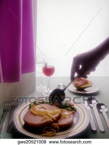Person holding a spoon over a plate of steak and beans View Large Photo Image Stock Photo - Person holding a spoon over a plate of steak and beans. Fotosearch