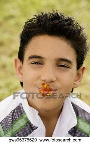 Portrait of a boy smiling with ketchup and mustard on his lips View Large Photo Image Stock Image - Portrait of a boy smiling with ketchup and mustard on his lips. Fotosearch