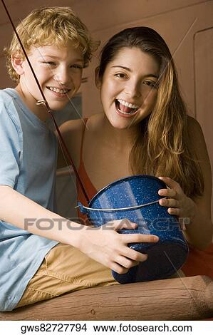 Portrait of a brother and sister smiling View Large Photo Image Picture - Portrait of a brother and sister smiling. Fotosearch