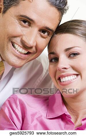 Portrait of a businessman and a businesswoman smiling View Large Photo Image Stock Image - Portrait of a businessman and a businesswoman smiling. Fotosearch