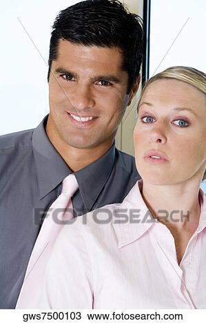 Portrait of a businessman and a businesswoman smiling View Large Photo Image Stock Image - Portrait of a businessman and a businesswoman smiling. Fotosearch