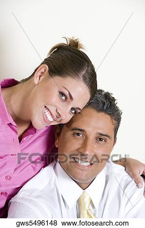 Portrait of a businessman and a businesswoman smiling View Large Photo Image Stock Photo - Portrait of a businessman and a businesswoman smiling. Fotosearch