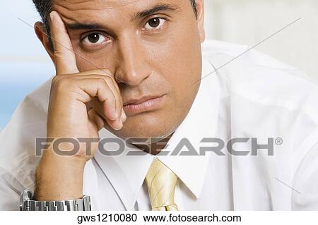 Portrait of a businessman looking sad View Large Photo Image Stock Image - Portrait of a businessman looking sad. Fotosearch