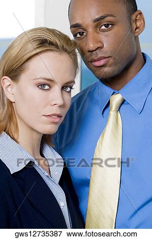 Portrait of a businessman standing with a businesswoman View Large Photo Image Stock Photo - Portrait of a businessman standing with a businesswoman. Fotosearch