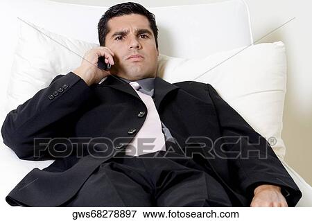 Portrait of a businessman talking on a mobile phone View Large Photo Image Stock Photo - Portrait of a businessman talking on a mobile phone. Fotosearch