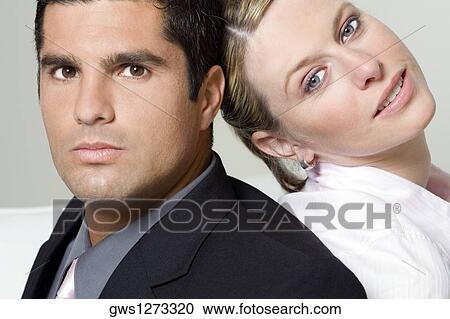 Portrait of a businessman with a businesswoman back to back View Large Photo Image Stock Image - Portrait of a businessman with a businesswoman back to back. Fotosearch