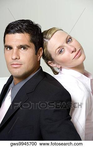 Portrait of a businessman with a businesswoman back to back View Large Photo Image Stock Image - Portrait of a businessman with a businesswoman back to back. Fotosearch